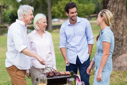 Happy family enjoying together in park