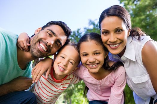 Portrait of smiling family in park on a sunny day