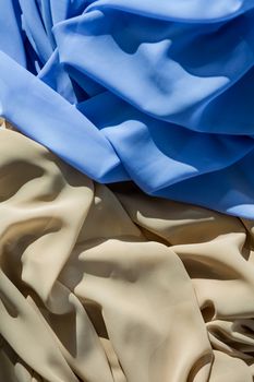 Close-up of blue and beige fabric in the studio