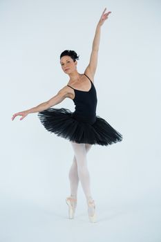 Portrait of ballerina practicing ballet dance in the studio