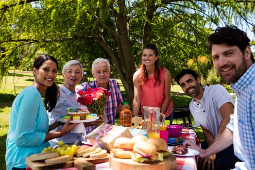 Portrait of happy family in park on a sunny day