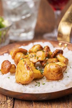 italian risotto with chanterelles on wood