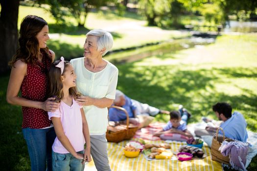 Happy family enjoying in park on sunny a day