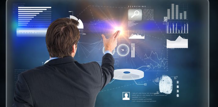 Rear view of young businessman in suit pointing against futuristic technology interface