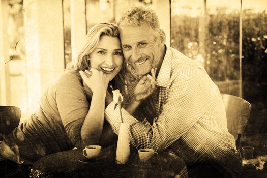 Grey background against portrait of romantic couple in restaurant