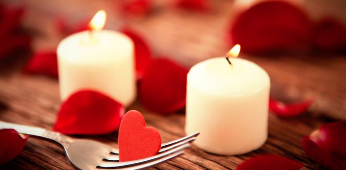 romantic candles with heart decoration