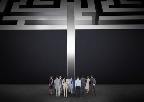 Digital composite of business people looking at maze