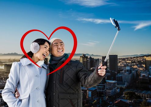 Composite image of romantic couple taking selfie from mobile phone