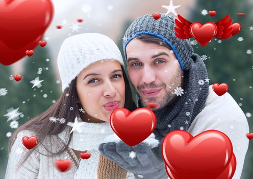 Composite image of romantic couple giving a flying kiss
