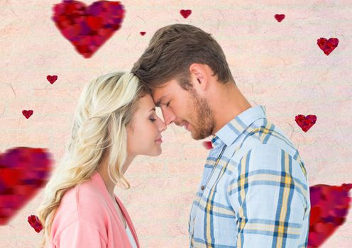 Romantic couple standing with closed eyes against digitally generated background