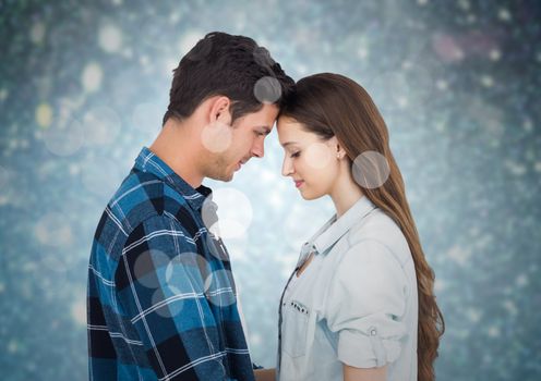 Composite image of romantic couple embracing each other against bokeh background