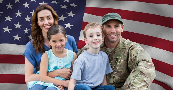 Soldier reunited with their family against american flag