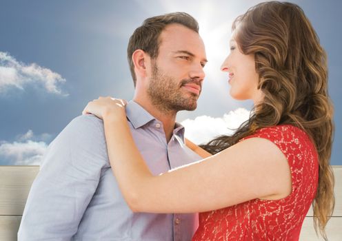 Digitally composite of romantic couple embracing face to face