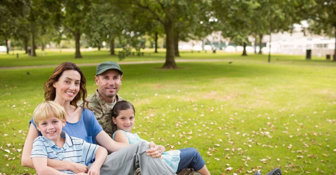 Portrait of smiling family sitting in park