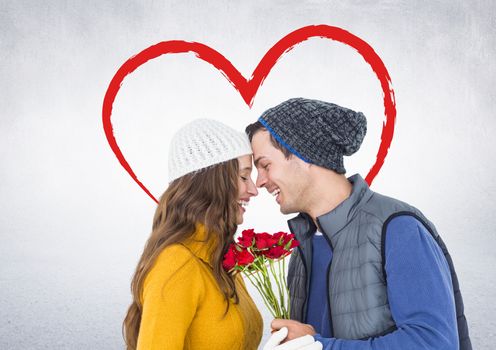 Romantic couple with face to face holding roses with digitally generated heart