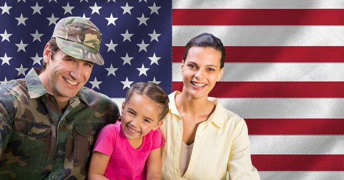 Portrait of soldier reunited with family against american flag in background