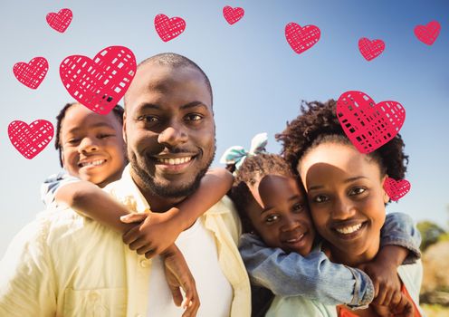 Portrait of happy family with digitally generated hearts