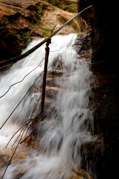 Waterfall overflowing onto the cliff side steps in Blue Mountains after it swell from the heavy rains