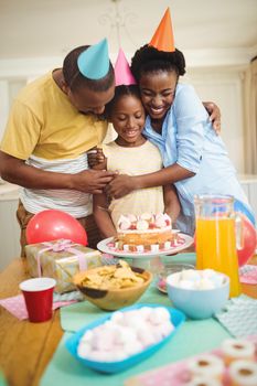 Happy family celebrating a birthday at home