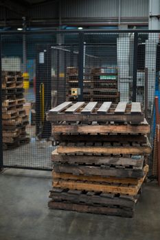 Stack of wooden pallets in bottle factory
