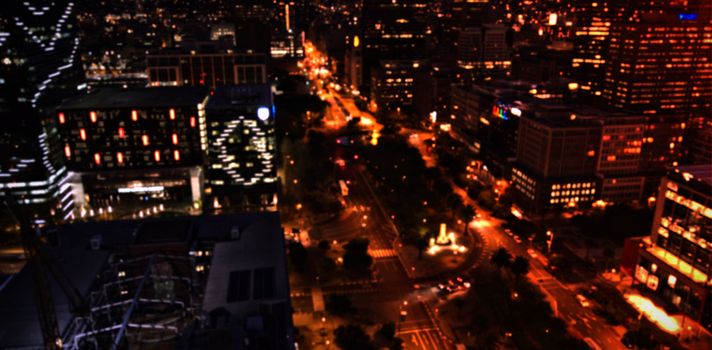 Aerial view of illuminated city at night