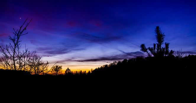 beautiful and colorful sunset on the Rucphense heide, Heather landscape in Rucphen, The Netherlands