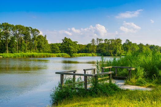 Water lake with jetty and beautiful nature scenery, the melanen, Halsteren, Bergen op zoom, The Netherlands