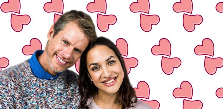 Close-up of happy couple against background with hearts