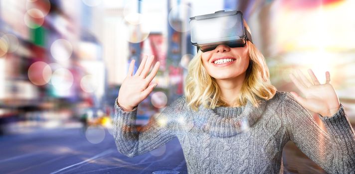Cheerful young woman using reality virtual headset against blurry new york street