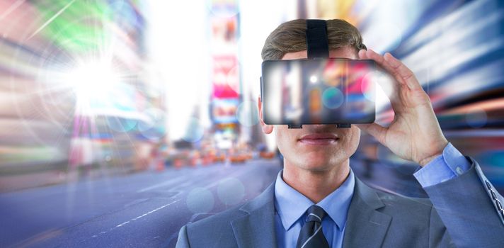 Businessman in suit using virtual reality headset against blurry new york street