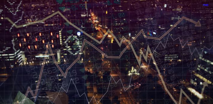 Stocks and shares against illuminated city at night