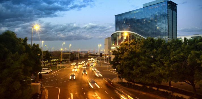 Aerial view cars moving on road in city at night