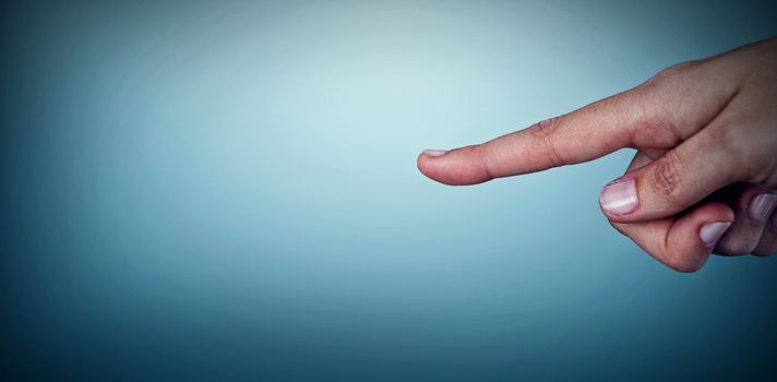 Human hand pointing on white background against grey vignette