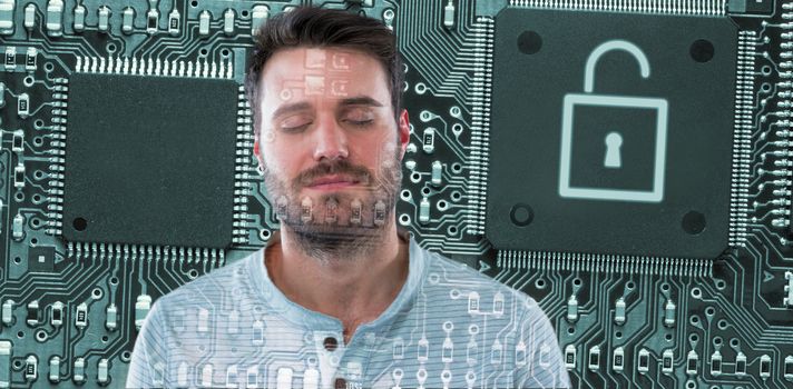 Handsome man with eyes closed against lock in circuit board