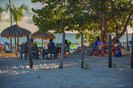 DOMINICUS, DOMINICAN REPUBLIC 6 FEBRAURY 2020: People on Dominicus Beach at sunset