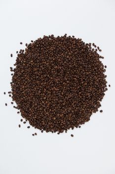 Roasted coffee beans on white background