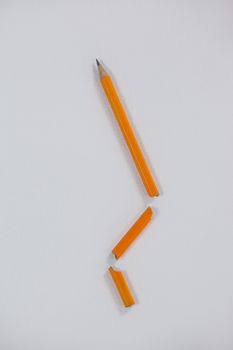 Close-up of broken pencil on white background