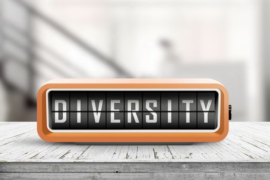Diversity word on a retro device on a wooden table in a bright office building