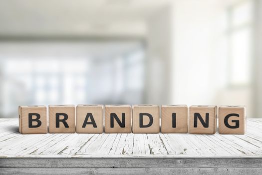 Branding sign on a desk in an office environment in bright daylight