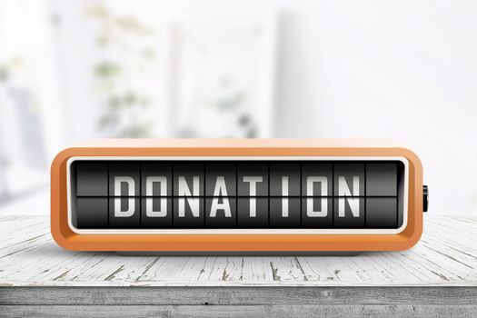 Donation message on a retro alarm clock on a table in a bright living room