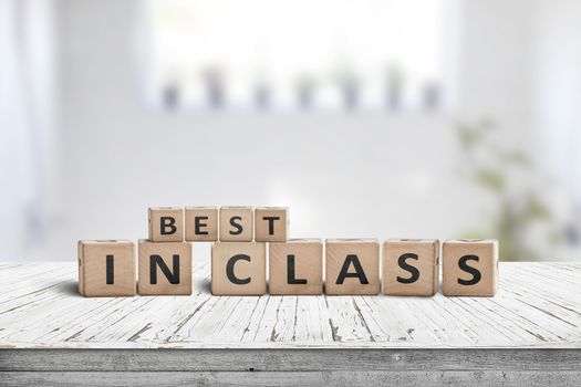 Best in class sign on a wooden table in a bright classroom