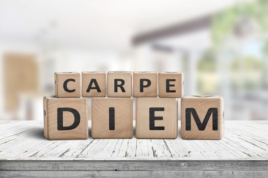 Carpe diem seize the day sign on a table in a bright home environment