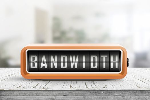 Bandwidth alarm message on a retro device in orange color in a bright room