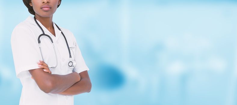 Young nurse with arms crossed against dental equipment