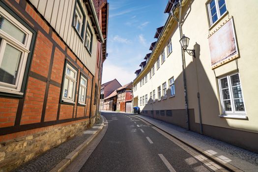 City street in Germany with old bavarian houses in the summer under a blue sky