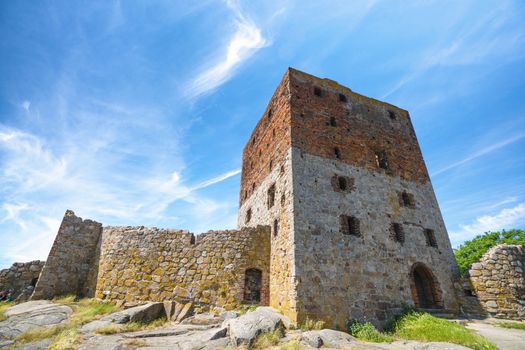 Castle ruin under a blue sky in the summer with many windows