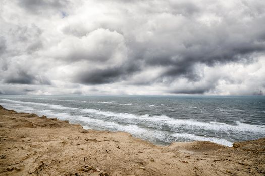 Dramatic weather over the sea with a rough coastal surface under a cloudy sky