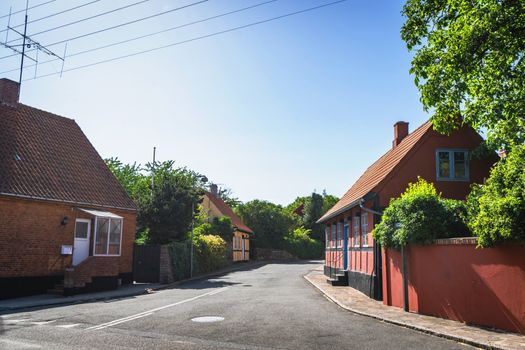 Streets of Denmark with colorful buildings on the island of Bornholm in the summer