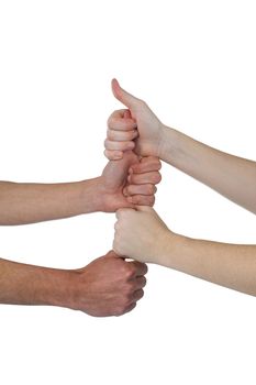 People stacking their fistsÂ against white background