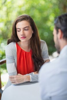 Depressed couple sitting in the restaurant